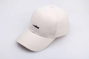 Minimalist beige baseball cap with blue whale embroidery made of cotton twill fabric
