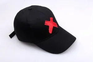 Unisex black punk hip hop baseball cap with red embroidered X logo and curved brim