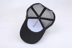 Internal view of black mesh trucker hat showing snapback closure and stitching details