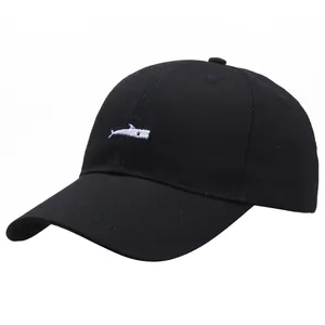 Minimalist black baseball cap with white shark embroidery and curved brim for sun protection