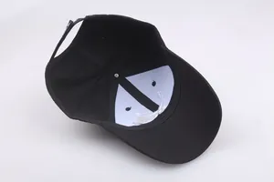 Internal view of black pilot baseball cap featuring breathable lining and adjustable strap
