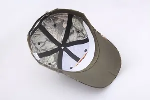 Internal view of tactical camouflage baseball cap showing reinforcement and wash label