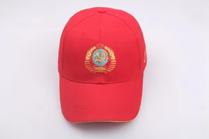 Detailed embroidery of Soviet CCCP emblem on red cotton twill baseball cap surface