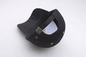 Close-up of adjustable metal buckle and embroidery detail on black cotton Masonic baseball cap