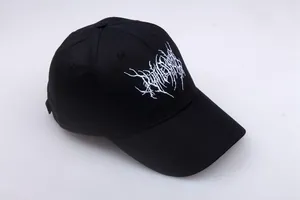 Close-up of white Gothic embroidery on black cotton twill baseball cap showing fine details