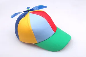 Detail view of colorful propeller baseball cap with blue plastic spinning top and multi-color panels