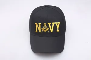 Detail of yellow Navy embroidery with Freemasonry logo on a black cotton baseball cap