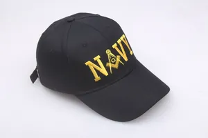 Close-up of yellow NAVY embroidery and Freemason symbol on a black cotton baseball cap