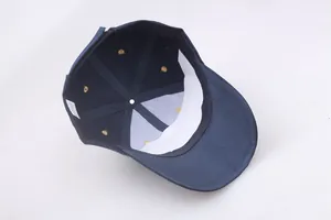 Detailed interior of navy baseball cap featuring white sweatband and reinforced panels