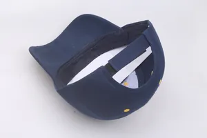 Detail of navy blue baseball cap showing adjustable velcro strap for custom fit