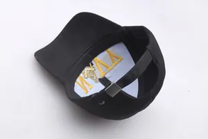 Detail view of Freemason logo gold embroidery inside the black cotton cadet cap