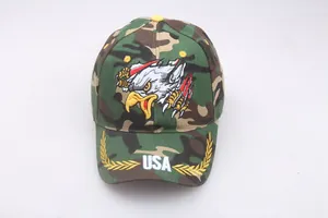 Detail of woodland camouflage baseball cap with eagle embroidery and white USA text
