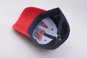 Detail of adjustable metal buckle and interior embroidery on cotton baseball cap