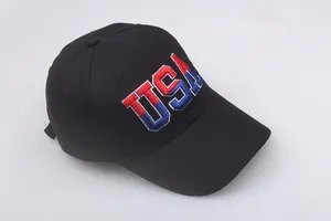 Close-up of the red and blue USA 3D embroidery on the front of a black cotton baseball cap