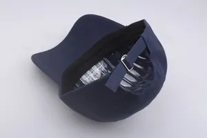Detailed view of dark blue cotton baseball cap back with adjustable metal buckle strap