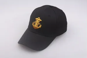 Detail of nautical gold anchor embroidery on black cotton twill navy captain hat