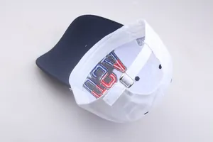 Detail of adjustable metal buckle and interior embroidery on the American flag baseball cap