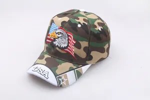 Macro detail of the Eagle and USA flag embroidery on the camo cotton baseball cap