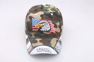 Detail of eagle embroidery and USA text on the brim of the camouflage baseball cap