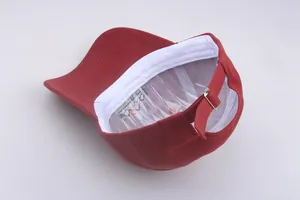 Detail view of the dark red baseball cap featuring a white sweatband and adjustable metal buckle