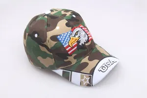Close-up of eagle embroidery and USA letters on camouflage cotton baseball cap
