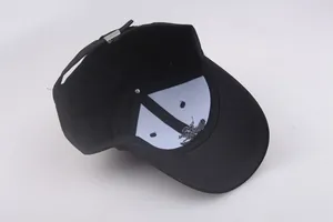 Detail view showing inner structure of black navy cap with reinforced lining and metal buckle
