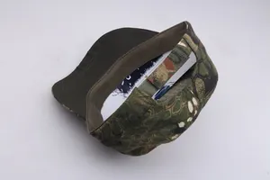 Detail view of honeycomb camo tactical hat interior showing depth and green fabric brim