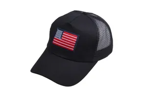 Detail of USA flag embroidery on black mesh trucker cap with breathable cotton fabric