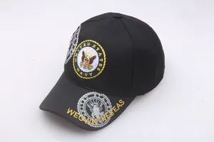 Close-up of US Navy eagle embroidery and WE OWN THE SEAS slogan on black baseball cap