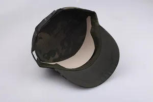 Detail view of the camouflage patrol cap interior showing stitch lines and wash tag