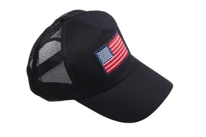 Black mesh trucker hat with American flag embroidery on front, classic baseball cap style