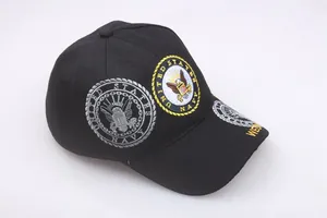 Detail of US Navy eagle emblem embroidery on a black cotton baseball cap for veterans