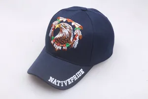 Detail of multi-color eagle head embroidery and Native Pride text on blue baseball cap