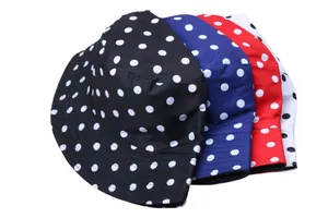 Close-up of polka dot bucket hats in four colors with high-quality fabric texture