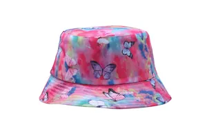 Detail of tie-dye bucket hat featuring colorful butterfly prints and cotton twill texture