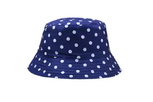 Detail of navy blue bucket hat with white polka dots made of durable cotton canvas