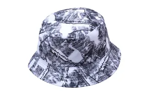 Detail of white bucket hat with black ink landscape print and decorative script