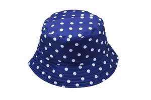 Detail of navy blue polka dot bucket hat featuring reinforced stitching on the wide brim