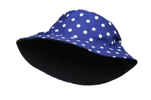 Detail of dark blue bucket hat with white polka dots and sun protection wide brim