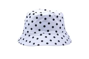 Detail view of black polka dot bucket hat with reinforced parallel stitching on the brim