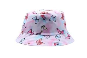 Detail of a tie-dye bucket hat featuring colorful butterfly prints on pink and blue fabric