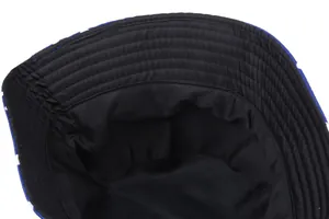 Detail view of reinforced stitching on black lining of a plaid sun bucket hat