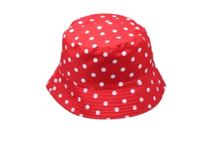 Detail of red bucket hat with white polka dots featuring sun protection fabric