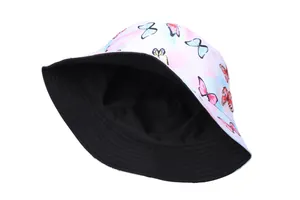 Detail of reversible sun bucket hat showing tie-dye butterfly print and black inner lining