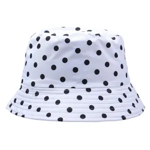 Chic black polka dot bucket hat for sun protection with breathable white fabric