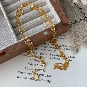 S925 sterling silver waterfall chain necklace in gold finish with a heart tag