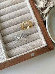 Detailed macro of S925 sterling silver lace rings with hollow mesh and cubic zirconia