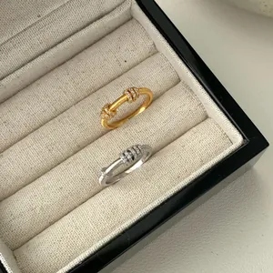 Anelli rotanti in argento S925 spazzolato con fascia diamantata scorrevole oro e argento