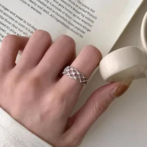Elegant S925 sterling silver lace ring with sparkling zircons worn in a chic setting