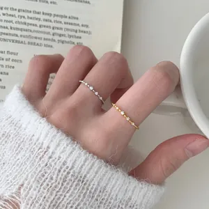 Elegant S925 sterling silver thin rings with cubic zirconia on model's fingers